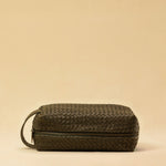The elegant Braided Travel Pouch VOYAGER by LABEL17  is handcrafted from fine, braided nappa leather and stands out with its soft feel and refined craftsmanship. A zipper keeps everything securely closed, while the interior is lined with water-resistant fabric and features practical side compartments – for stylish organization on the go. Handmade in Morocco.