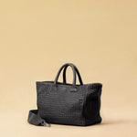 The Cabas Medium by LABEL17 is a lightweight handbag crafted from supple, vegetable-tanned nappa leather. Hand-braided and finished with a zip closure and detachable shoulder strap, it features a leather-lined interior with a secure inner pocket – combining refined design with everyday functionality. Handmade in Morocco.