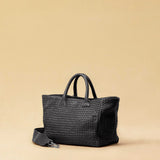 The Cabas Medium by LABEL17 is a lightweight handbag crafted from supple, vegetable-tanned nappa leather. Hand-braided and finished with a zip closure and detachable shoulder strap, it features a leather-lined interior with a secure inner pocket – combining refined design with everyday functionality. Handmade in Morocco.