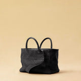 The Cabas Medium by LABEL17 is a lightweight handbag crafted from supple, vegetable-tanned nappa leather. Hand-braided and finished with a zip closure and detachable shoulder strap, it features a leather-lined interior with a secure inner pocket – combining refined design with everyday functionality. Handmade in Morocco.