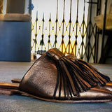 The Mule CHOUCHA by LABEL17 is crafted from supple, vegetable-tanned lamb nappa leather. A large, soft pompom sways elegantly with every step, adding a playful yet refined touch to the design. Handmade in Morocco.