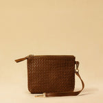The Braided Pouch GAIA by LABEL17 is hand-braided from soft, vegetable-tanned nappa leather using an intricate braiding technique. Designed to carry your essentials, it features a leather strap with a carabiner, allowing you to wear it on its own or attach it seamlessly inside your LABEL17 bag.