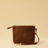 The Braided Pouch GAIA by LABEL17 is hand-braided from soft, vegetable-tanned nappa leather using an intricate braiding technique. Designed to carry your essentials, it features a leather strap with a carabiner, allowing you to wear it on its own or attach it seamlessly inside your LABEL17 bag.