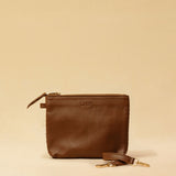 The Braided Pouch GAIA by LABEL17 is hand-braided from soft, vegetable-tanned nappa leather using an intricate braiding technique. Designed to carry your essentials, it features a leather strap with a carabiner, allowing you to wear it on its own or attach it seamlessly inside your LABEL17 bag.