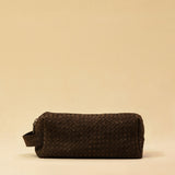The elegant Braided Travel Pouch VOYAGER by LABEL17  is handcrafted from fine, braided nappa leather and stands out with its soft feel and refined craftsmanship. A zipper keeps everything securely closed, while the interior is lined with water-resistant fabric and features practical side compartments – for stylish organization on the go. Handmade in Morocco.