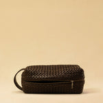 The elegant Braided Travel Pouch VOYAGER by LABEL17  is handcrafted from fine, braided nappa leather and stands out with its soft feel and refined craftsmanship. A zipper keeps everything securely closed, while the interior is lined with water-resistant fabric and features practical side compartments – for stylish organization on the go. Handmade in Morocco.