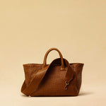 The Cabas Medium by LABEL17 is a lightweight handbag crafted from supple, vegetable-tanned nappa leather. Hand-braided and finished with a zip closure and detachable shoulder strap, it features a leather-lined interior with a secure inner pocket – combining refined design with everyday functionality. Handmade in Morocco.