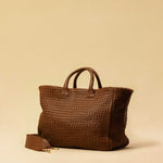 The Cabas Standard by LABEL17 is a larger version of the Cabas Medium – a lightweight handbag made from supple, vegetable-tanned nappa leather. Hand-braided, it features a zip closure, detachable shoulder strap, and a leather-lined interior with a secure inner pocket.
Spacious enough to fit your 14“ laptop in our Laptop Case 14 – perfect for a stylish everyday routine. Handmade in Morocco