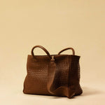 The Cabas Standard by LABEL17 is a larger version of the Cabas Medium – a lightweight handbag made from supple, vegetable-tanned nappa leather. Hand-braided, it features a zip closure, detachable shoulder strap, and a leather-lined interior with a secure inner pocket.
Spacious enough to fit your 14“ laptop in our Laptop Case 14 – perfect for a stylish everyday routine. Handmade in Morocco