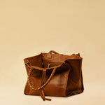 The Shoulder Bag IVY by LABEL17 ist crafted from supple Nappa leather, stands out for its artisanal detailing, distinctive side seams, and long braided handles.