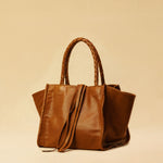 The Shoulder Bag IVY by LABEL17 ist crafted from supple Nappa leather, stands out for its artisanal detailing, distinctive side seams, and long braided handles.