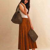 The Shoulder Bag ORIGINAL by LABEL17 is a timeless piece, crafted from fine, vegetable-tanned nappa leather and hand-braided. It features a zipper closure and a convenient interior pocket for your essentials.