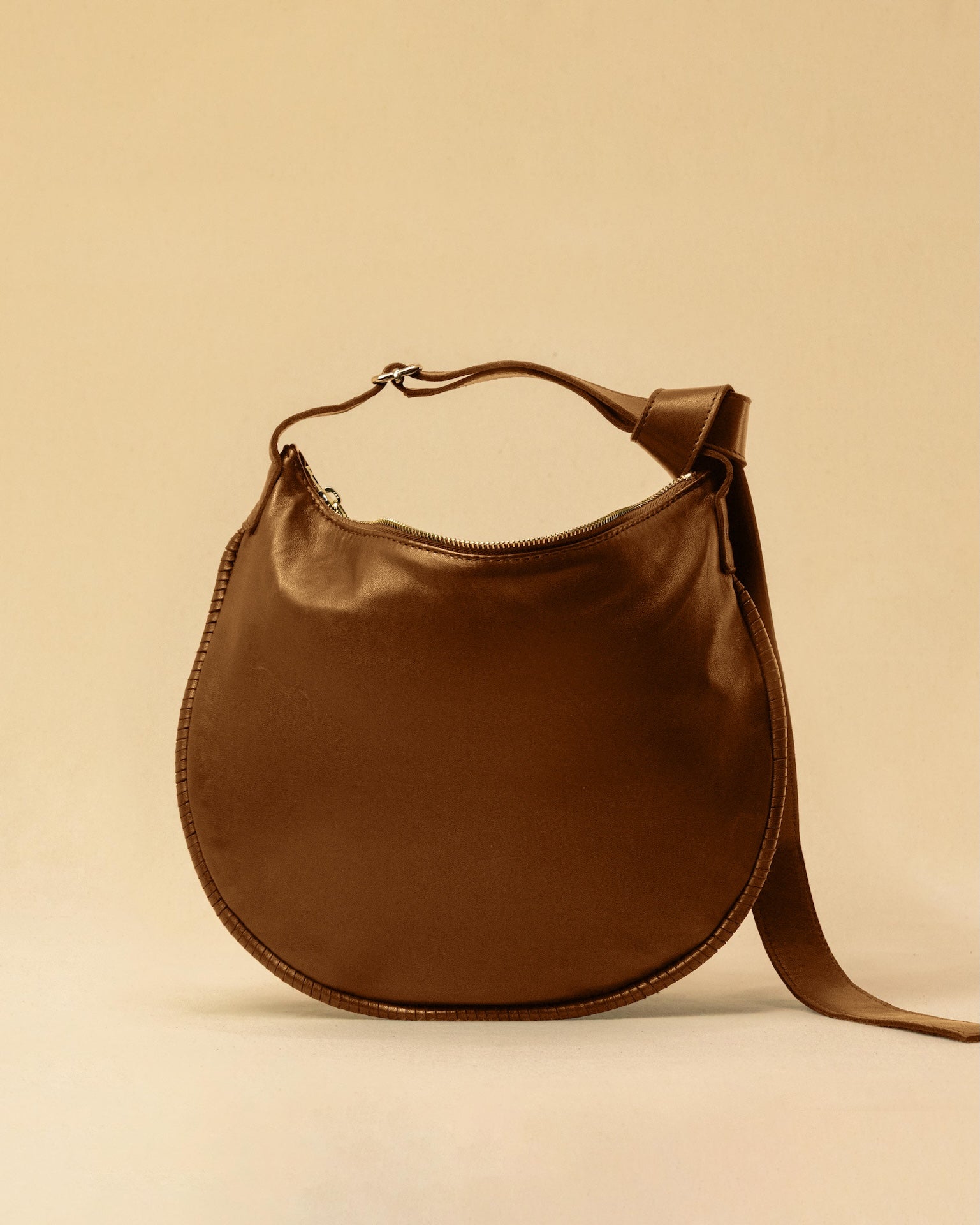 LABEL17's Shoulder Bag Saddle IVY Medium in Cognac, made of finest Lamb-Nappa, hand-crafted in Morocco