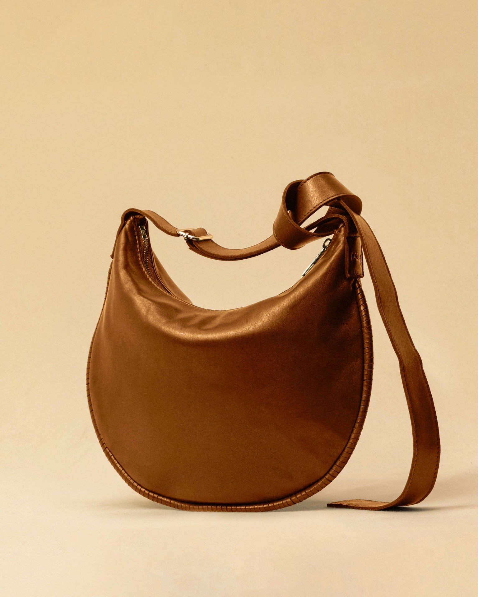 LABEL17's Shoulder Bag Saddle IVY Medium in Cognac, made of finest Lamb-Nappa, hand-crafted in Morocco