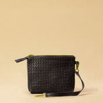 The Braided Pouch GAIA by LABEL17 is hand-braided from soft, vegetable-tanned nappa leather using an intricate braiding technique. Designed to carry your essentials, it features a leather strap with a carabiner, allowing you to wear it on its own or attach it seamlessly inside your LABEL17 bag.