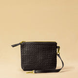 The Braided Pouch GAIA by LABEL17 is hand-braided from soft, vegetable-tanned nappa leather using an intricate braiding technique. Designed to carry your essentials, it features a leather strap with a carabiner, allowing you to wear it on its own or attach it seamlessly inside your LABEL17 bag.