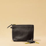 The Braided Pouch GAIA by LABEL17 is hand-braided from soft, vegetable-tanned nappa leather using an intricate braiding technique. Designed to carry your essentials, it features a leather strap with a carabiner, allowing you to wear it on its own or attach it seamlessly inside your LABEL17 bag.