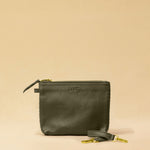 The Braided Pouch GAIA by LABEL17 is hand-braided from soft, vegetable-tanned nappa leather using an intricate braiding technique. Designed to carry your essentials, it features a leather strap with a carabiner, allowing you to wear it on its own or attach it seamlessly inside your LABEL17 bag.