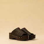 Open Toe Clogs ELLA in dark brown by LABEL17, crafted from supple, vegetable-tanned lamb nappa leather. The shoe features a durable Vibram sole for comfort and stability. The artisanal craftsmanship enhances the overall aesthetic, making these clogs a true statement piece. Quiet luxury at its best. Handmade in Greece.