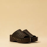 Open Toe Clogs ELLA in dark brown by LABEL17, crafted from supple, vegetable-tanned lamb nappa leather. The shoe features a durable Vibram sole for comfort and stability. The artisanal craftsmanship enhances the overall aesthetic, making these clogs a true statement piece. Quiet luxury at its best. Handmade in Greece.