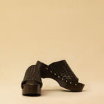 Open Toe Clogs ELLA in dark brown by LABEL17, crafted from supple, vegetable-tanned lamb nappa leather. The shoe features a durable Vibram sole for comfort and stability. The artisanal craftsmanship enhances the overall aesthetic, making these clogs a true statement piece. Quiet luxury at its best. Handmade in Greece.