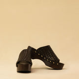 Open Toe Clogs ELLA in dark brown by LABEL17, crafted from supple, vegetable-tanned lamb nappa leather. The shoe features a durable Vibram sole for comfort and stability. The artisanal craftsmanship enhances the overall aesthetic, making these clogs a true statement piece. Quiet luxury at its best. Handmade in Greece.