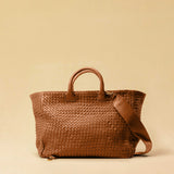 The Cabas Standard by LABEL17 is a larger version of the Cabas Medium – a lightweight handbag made from supple, vegetable-tanned nappa leather. Hand-braided, it features a zip closure, detachable shoulder strap, and a leather-lined interior with a secure inner pocket.
Spacious enough to fit your 14“ laptop in our Laptop Case 14 – perfect for a stylish everyday routine. Handmade in Morocco