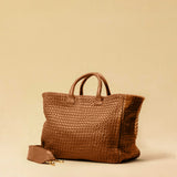 The Cabas Standard by LABEL17 is a larger version of the Cabas Medium – a lightweight handbag made from supple, vegetable-tanned nappa leather. Hand-braided, it features a zip closure, detachable shoulder strap, and a leather-lined interior with a secure inner pocket.
Spacious enough to fit your 14“ laptop in our Laptop Case 14 – perfect for a stylish everyday routine. Handmade in Morocco