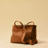 The Cabas Standard by LABEL17 is a larger version of the Cabas Medium – a lightweight handbag made from supple, vegetable-tanned nappa leather. Hand-braided, it features a zip closure, detachable shoulder strap, and a leather-lined interior with a secure inner pocket.
Spacious enough to fit your 14“ laptop in our Laptop Case 14 – perfect for a stylish everyday routine. Handmade in Morocco