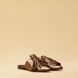 The Mule CHOUCHA by LABEL17 is crafted from supple, vegetable-tanned lamb nappa leather. A large, soft pompom sways elegantly with every step, adding a playful yet refined touch to the design. Handmade in Morocco.