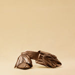 The Mule CHOUCHA by LABEL17 is crafted from supple, vegetable-tanned lamb nappa leather. A large, soft pompom sways elegantly with every step, adding a playful yet refined touch to the design. Handmade in Morocco.