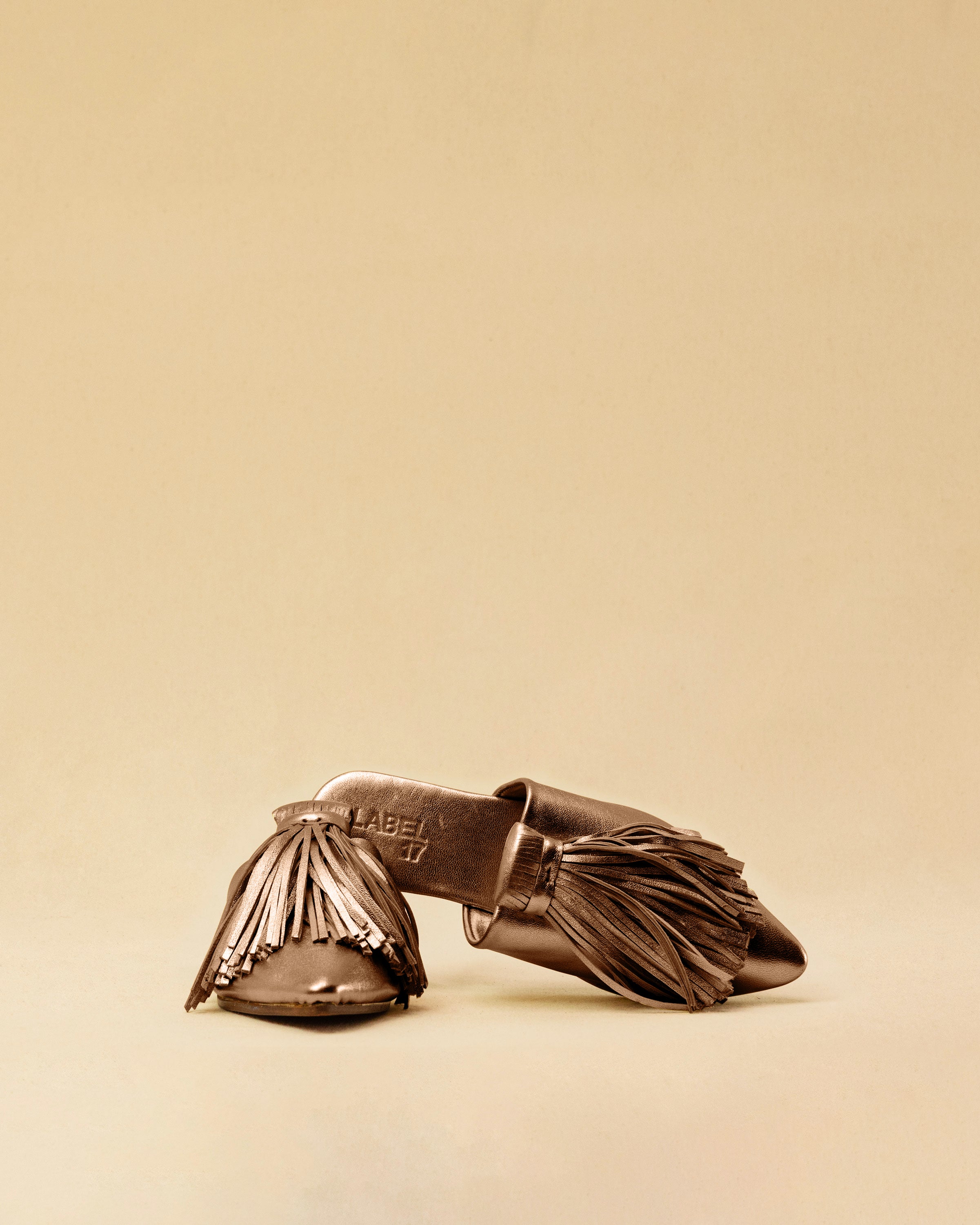 The Mule CHOUCHA by LABEL17 is crafted from supple, vegetable-tanned lamb nappa leather. A large, soft pompom sways elegantly with every step, adding a playful yet refined touch to the design. Handmade in Morocco.