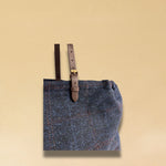 LABEL17 presents a detail of the Shoulder Bag Large in Harris Tweed, Blue, stitched with #LOVE