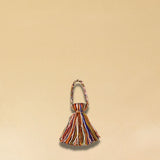 Der farbiger Wool-Pompom von LABEL17 kann als Taschenzubehör, gefertigt aus reiner Schurwolle. Hergestellt in einer Frauenkooperative in Marokko.