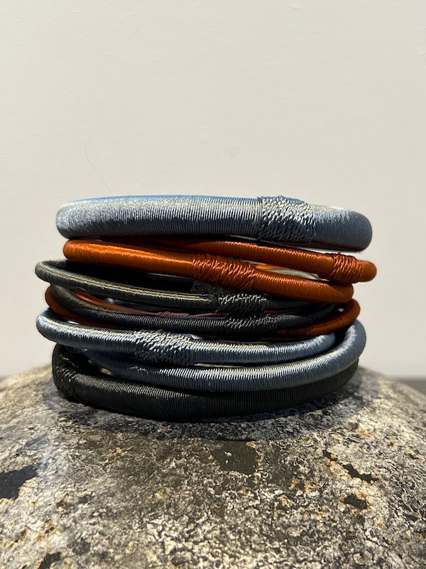 A set of different colored Bangles made of thread