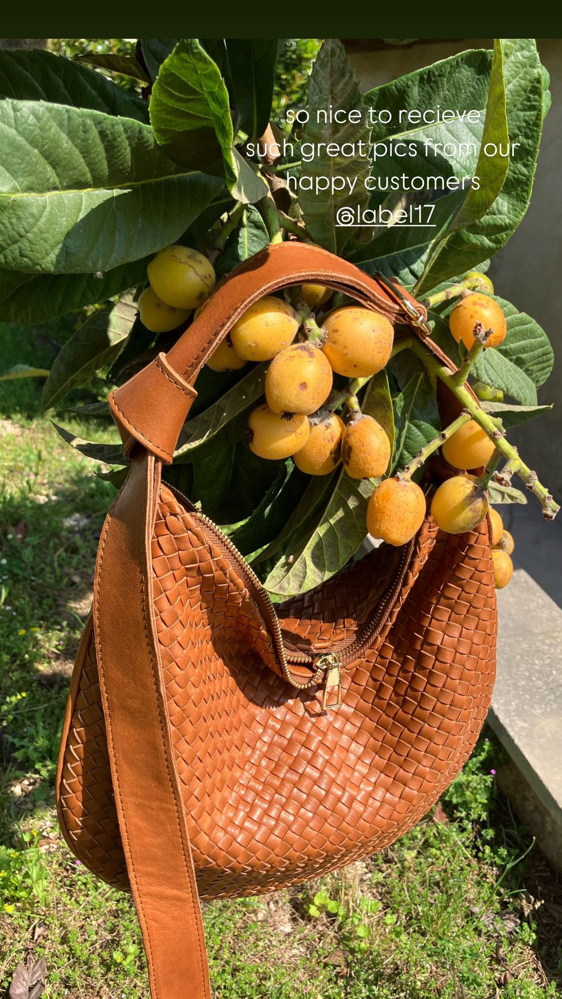 LABEL17's Shoulder Bag LUNA in Cognac presented next to a lemon tree.