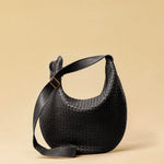 The Saddle Bag LUNA by LABEL17 is hand-braided from the finest vegetable-tanned nappa leather. Its softly curved saddle shape is elegantly defined by a delicate piped seam, allowing it to rest comfortably against the body. It features a zip closure, a leather-lined interior, and a secure inner pocket. The adjustable strap allows for shoulder or crossbody wear – a versatile companion for every day. Handmade in Morocco.