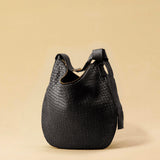 The Saddle Bag LUNA by LABEL17 is hand-braided from the finest vegetable-tanned nappa leather. Its softly curved saddle shape is elegantly defined by a delicate piped seam, allowing it to rest comfortably against the body. It features a zip closure, a leather-lined interior, and a secure inner pocket. The adjustable strap allows for shoulder or crossbody wear – a versatile companion for every day. Handmade in Morocco.
