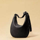 The Saddle Bag LUNA by LABEL17 is hand-braided from the finest vegetable-tanned nappa leather. Its softly curved saddle shape is elegantly defined by a delicate piped seam, allowing it to rest comfortably against the body. It features a zip closure, a leather-lined interior, and a secure inner pocket. The adjustable strap allows for shoulder or crossbody wear – a versatile companion for every day. Handmade in Morocco.