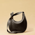 The Saddle Bag LUNA by LABEL17 is hand-braided from the finest vegetable-tanned nappa leather. Its softly curved saddle shape is elegantly defined by a delicate piped seam, allowing it to rest comfortably against the body. It features a zip closure, a leather-lined interior, and a secure inner pocket. The adjustable strap allows for shoulder or crossbody wear – a versatile companion for every day. Handmade in Morocco.