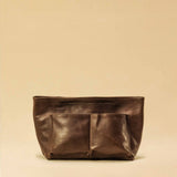 The Bag Organizer PENNY by LABEL17 is crafted from supple nappa leather and brings effortless style and order to large handbags. With integrated outer and inner compartments and a magnetic closure, it fits perfectly into our Shoulder Bag ORIGINAL.