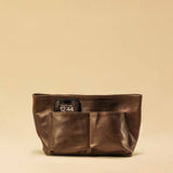 The Bag Organizer PENNY by LABEL17 is crafted from supple nappa leather and brings effortless style and order to large handbags. With integrated outer and inner compartments and a magnetic closure, it fits perfectly into our Shoulder Bag ORIGINAL.