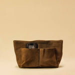The Bag Organizer PENNY by LABEL17 is crafted from supple suede leather and brings effortless style and order to large handbags. With integrated outer and inner compartments and a magnetic closure, it fits perfectly into our Shoulder Bag ORIGINAL.