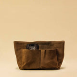 The Bag Organizer PENNY by LABEL17 is crafted from supple suede leather and brings effortless style and order to large handbags. With integrated outer and inner compartments and a magnetic closure, it fits perfectly into our Shoulder Bag ORIGINAL.