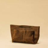 The Bag Organizer PENNY by LABEL17 is crafted from supple suede leather and brings effortless style and order to large handbags. With integrated outer and inner compartments and a magnetic closure, it fits perfectly into our Shoulder Bag ORIGINAL.