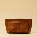 The Bag Organizer PENNY by LABEL17 is crafted from supple nappa leather and brings effortless style and order to large handbags. With integrated outer and inner compartments and a magnetic closure, it fits perfectly into our Shoulder Bag ORIGINAL.