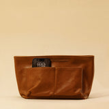 The Bag Organizer PENNY by LABEL17 is crafted from supple nappa leather and brings effortless style and order to large handbags. With integrated outer and inner compartments and a magnetic closure, it fits perfectly into our Shoulder Bag ORIGINAL.