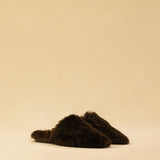 The ‘Shearling Mules CHARLY’ slipper by LABEL17 is crafted from soft lambskin for exceptional comfort. The lambskin-lined footbed provides a soft feel with every step. Featuring a fine leather sole and a subtle 1.5 cm heel, this shoe is perfect for both indoor and outdoor wear. Handmade in Morocco.