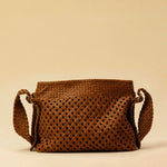 The Shoulder Bag ALIA by LABEL17 is intricately hand-braided using a combination of braiding techniques – a true masterpiece of craftsmanship. It features a zip closure, a leather-lined interior, and a secure inner pocket. With an adjustable strap, it can be worn over the shoulder or crossbody – perfect from day to evening. Handmade in Morocco.