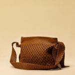 The Shoulder Bag ALIA by LABEL17 is intricately hand-braided using a combination of braiding techniques – a true masterpiece of craftsmanship. It features a zip closure, a leather-lined interior, and a secure inner pocket. With an adjustable strap, it can be worn over the shoulder or crossbody – perfect from day to evening. Handmade in Morocco.